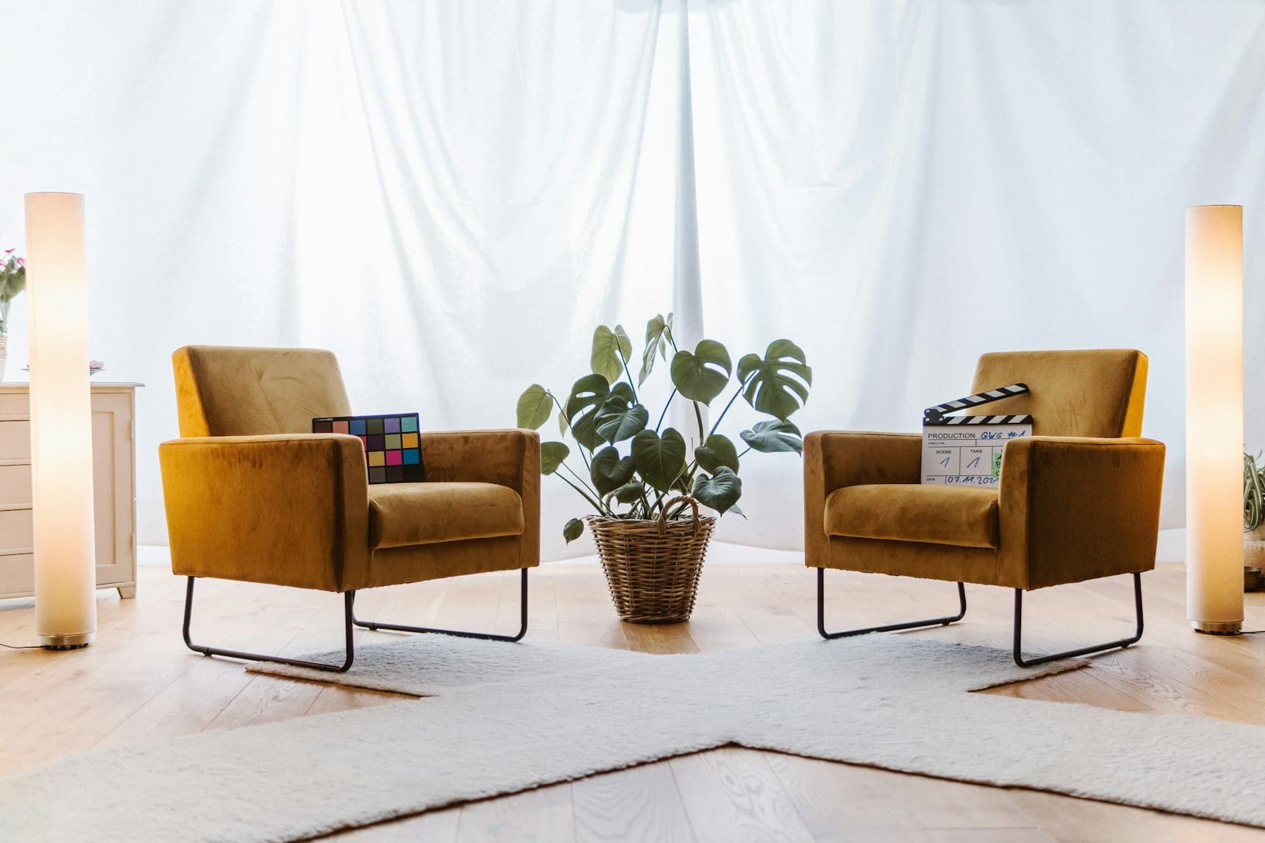 Quiet counselling room with two chairs, a side table and a houseplant