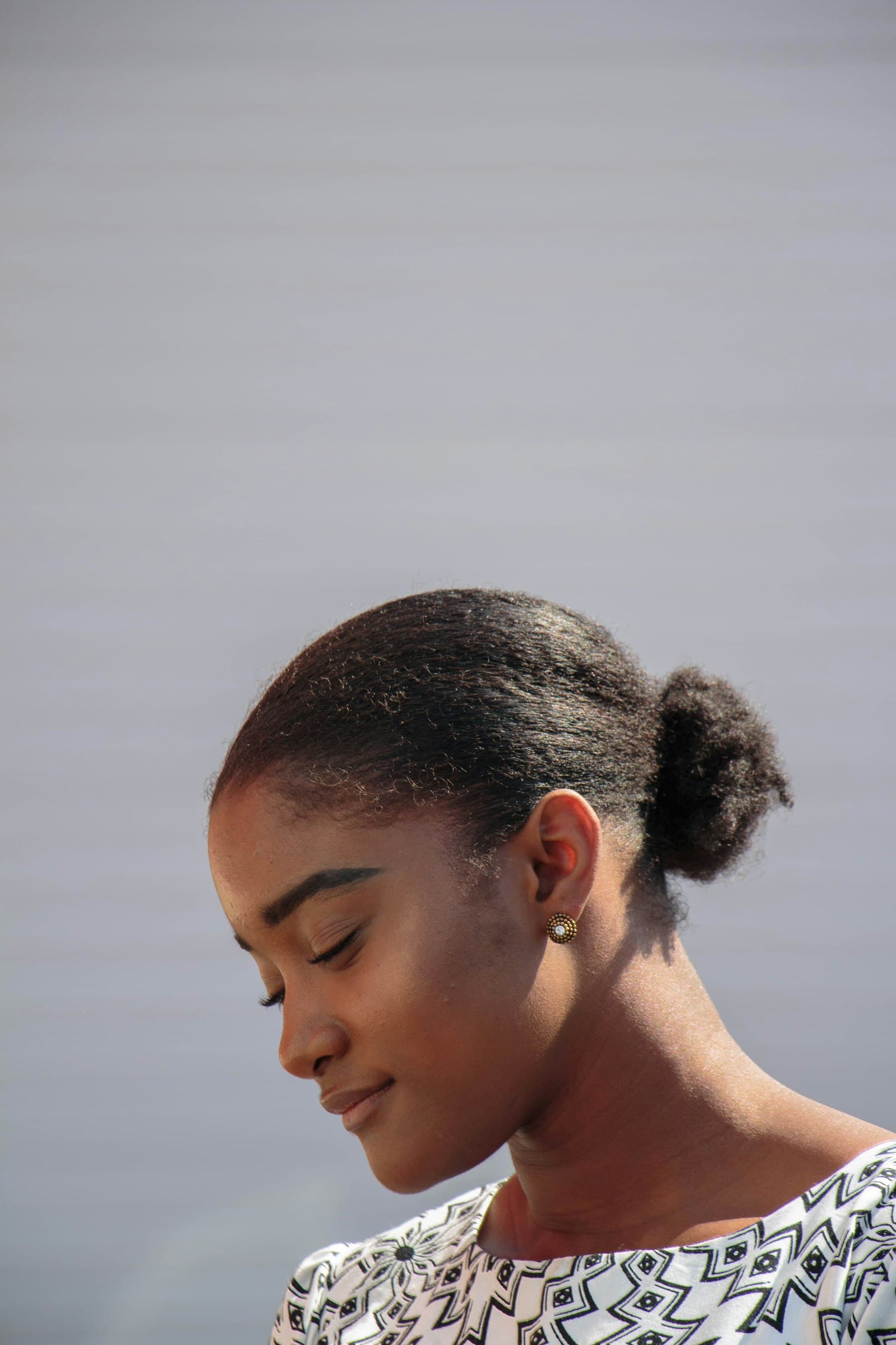 Woman with eyes closed in quiet reflection